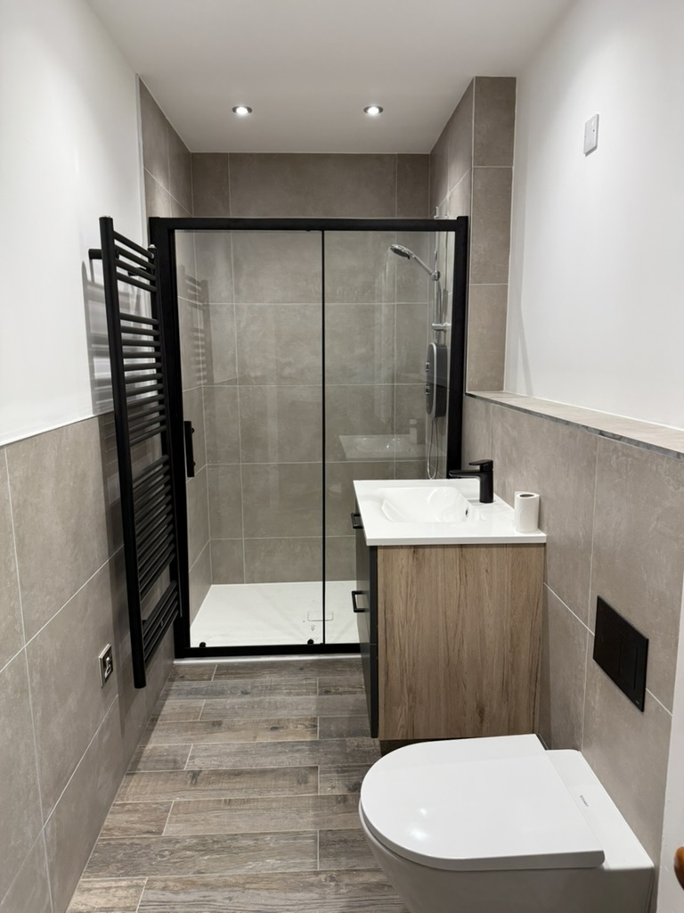 Finished bathroom with shower enclosure and vanity illustrating Granite Builders bathroom work across Aberdeenshire