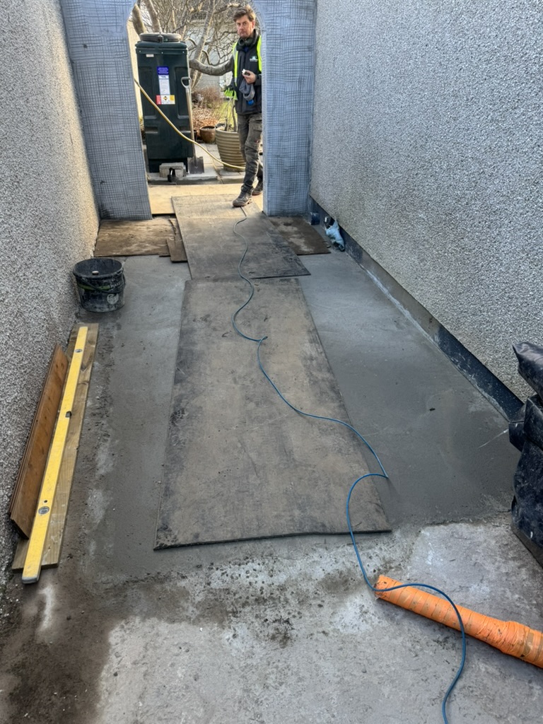 Paving being laid in a passage in Aberdeen