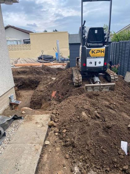 Mini digger excavating the foundation trench for a home extension in Aberdeenshire