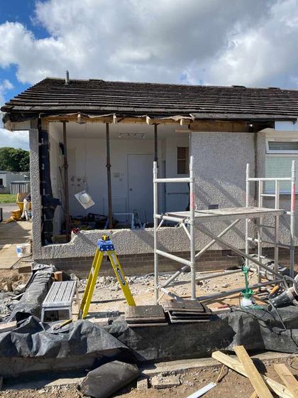 New extension shell meeting the original harled render wall on an Aberdeen bungalow