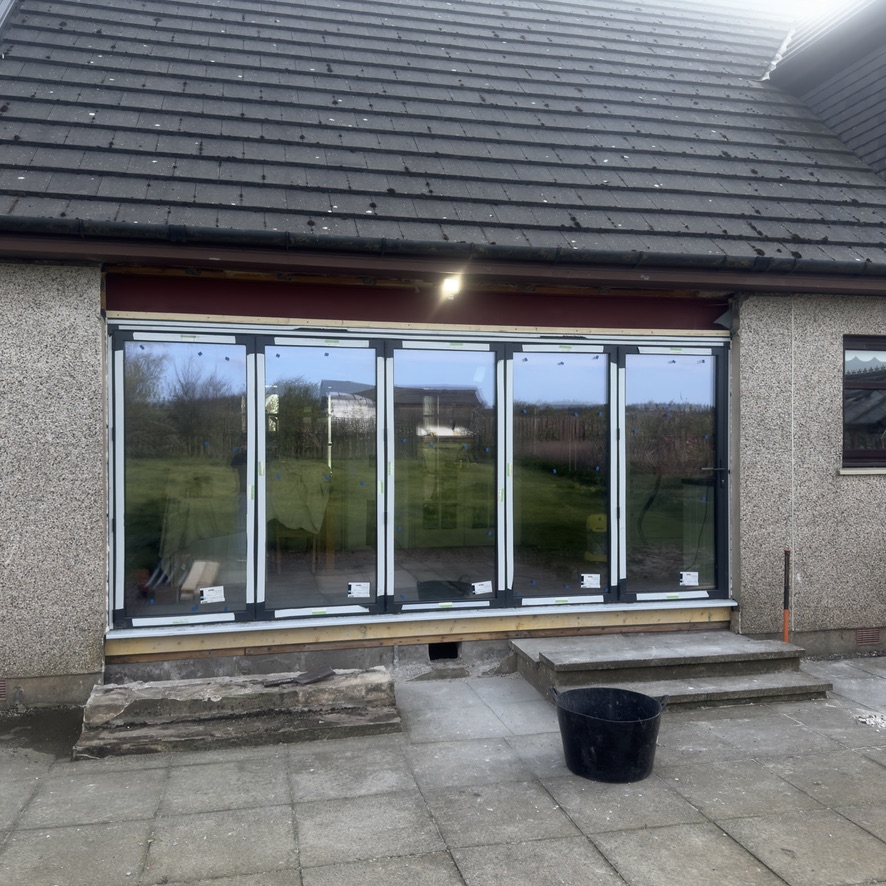 Glazed rear extension with bifold doors completed by Granite Builders in Peterhead
