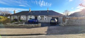 Finished extension on a granite semi-detached bungalow in Aberdeen, with matching granite dressing and slate roof