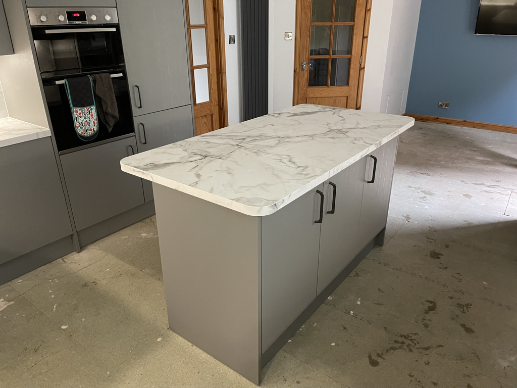 Kitchen with island opening into a diner fitted in Aberdeenshire