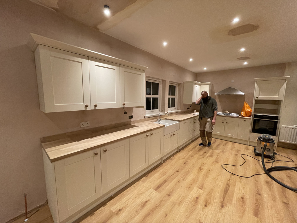 Kitchen with island and oven fitted by Granite Builders kitchen fitters in Aberdeenshire
