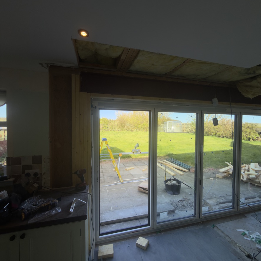 Kitchen before renovation with old patio doors in Peterhead