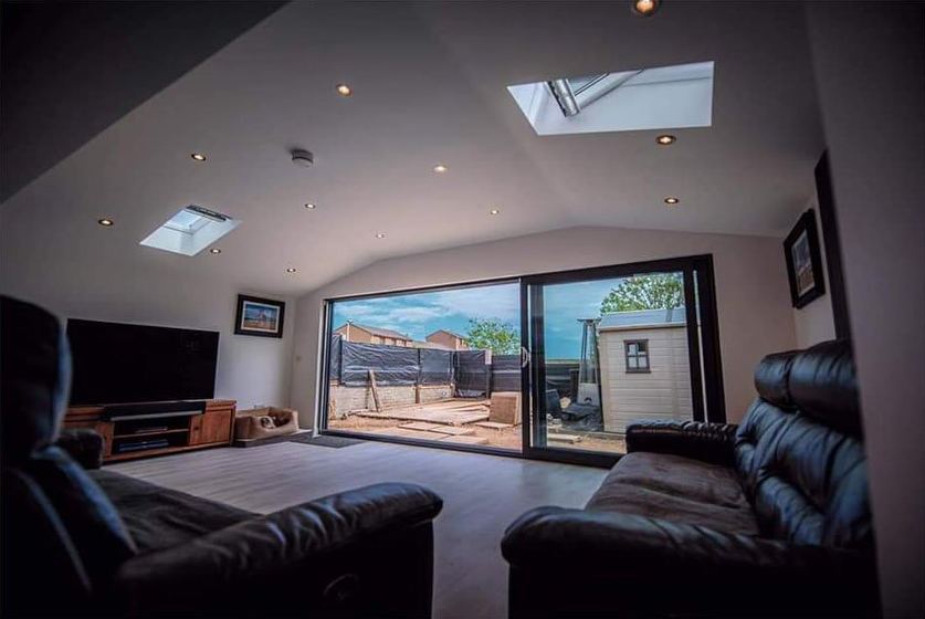 Finished open-plan extension interior with roof skylights flooding the room with daylight, Aberdeen
