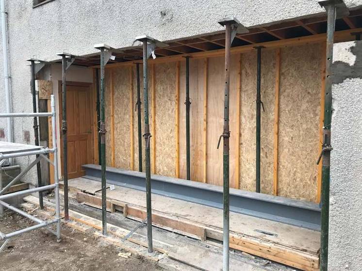 Steel beam propped with acrow supports as the rear wall of an Aberdeenshire home is opened up