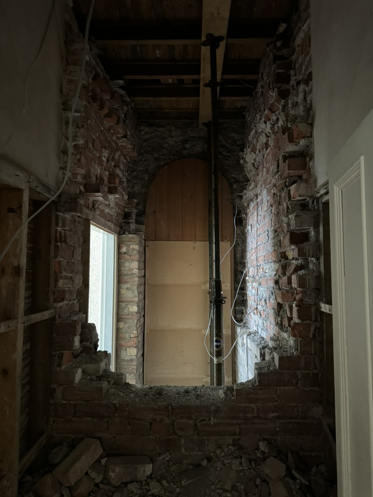 Exposed stonework and archway during repair in Inverbervie