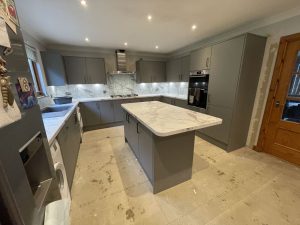 Aberdeenshire home with a fully renovated kitchen-diner, grey shaker cabinetry, marble island, integrated appliances