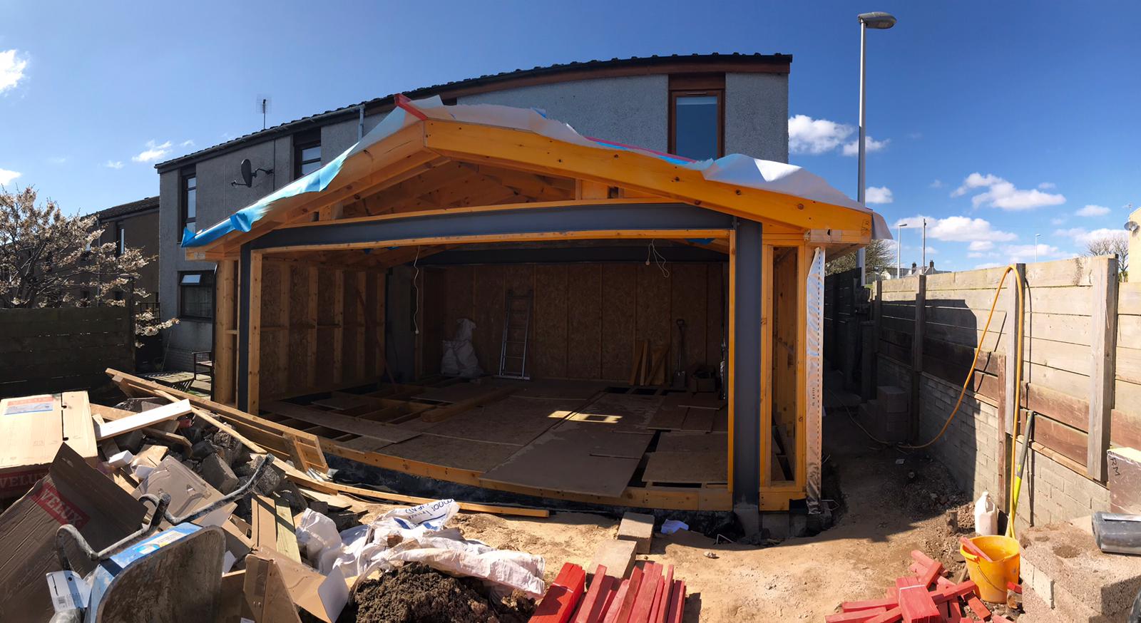 Home extension under construction showing the steel goalpost beam, timber frame and floor structure