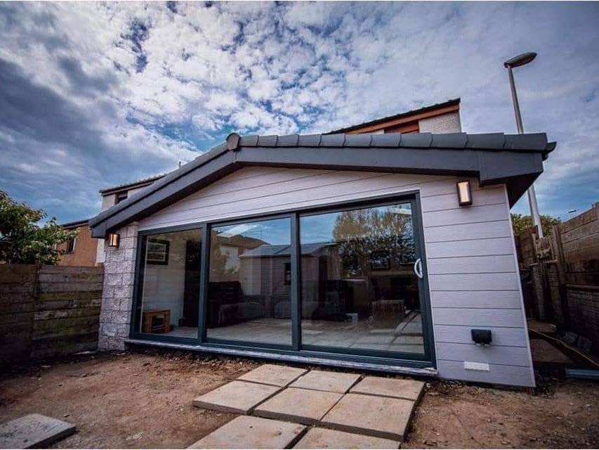 Extended family home in Aberdeen with a completed single storey rear extension and sliding doors